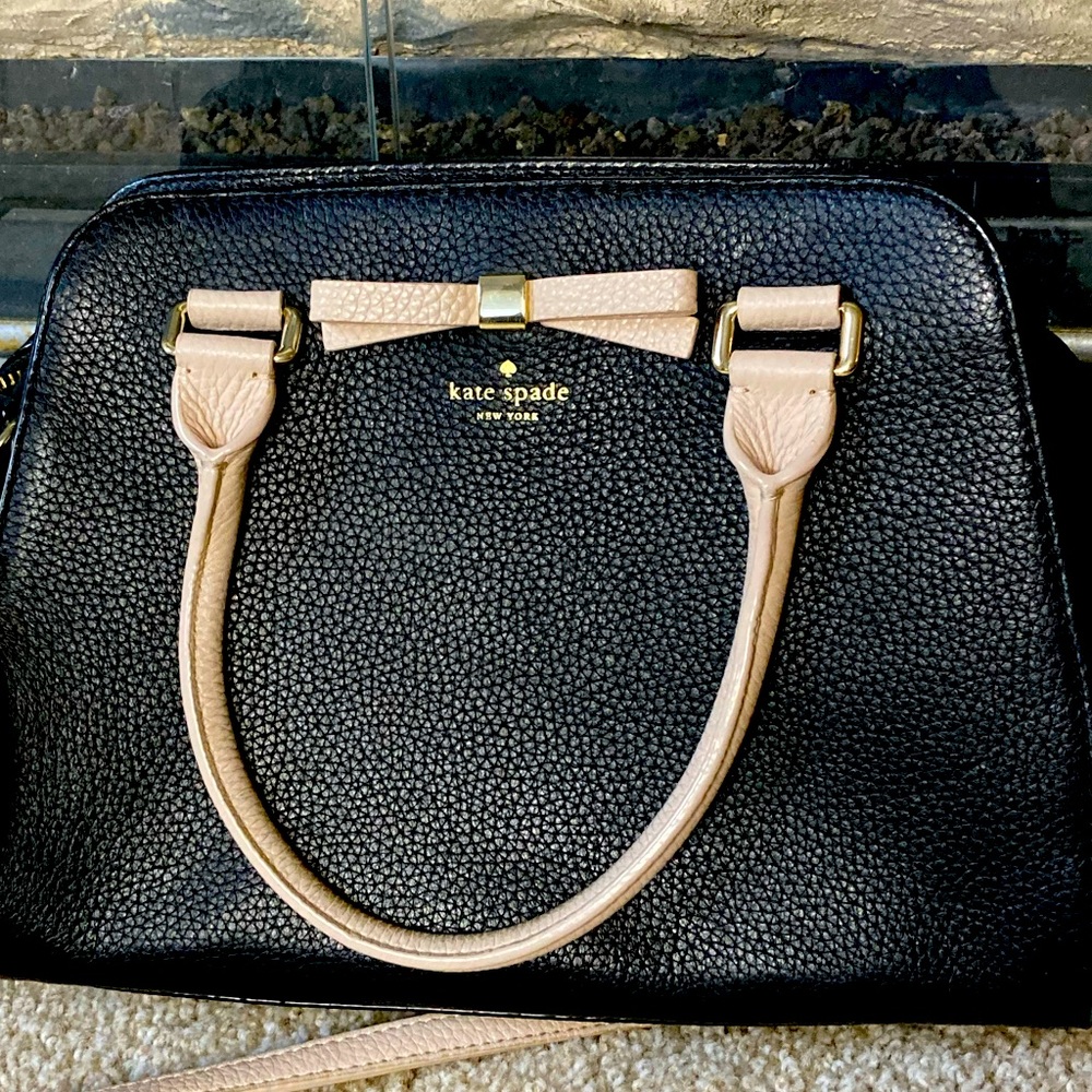 Authentic Kate Spade purse with light pink strap and bow.